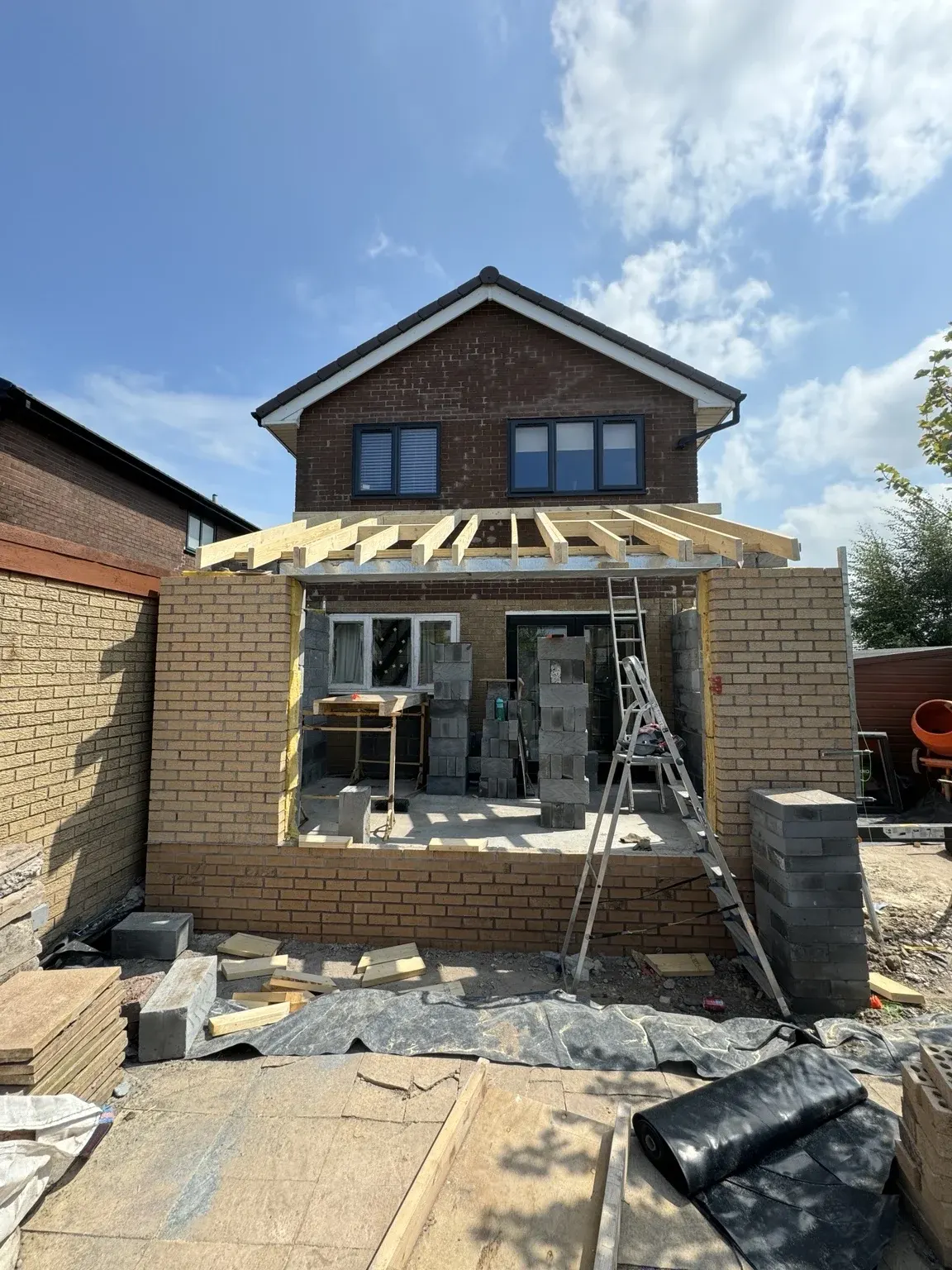 Extension walls progressing to roof level