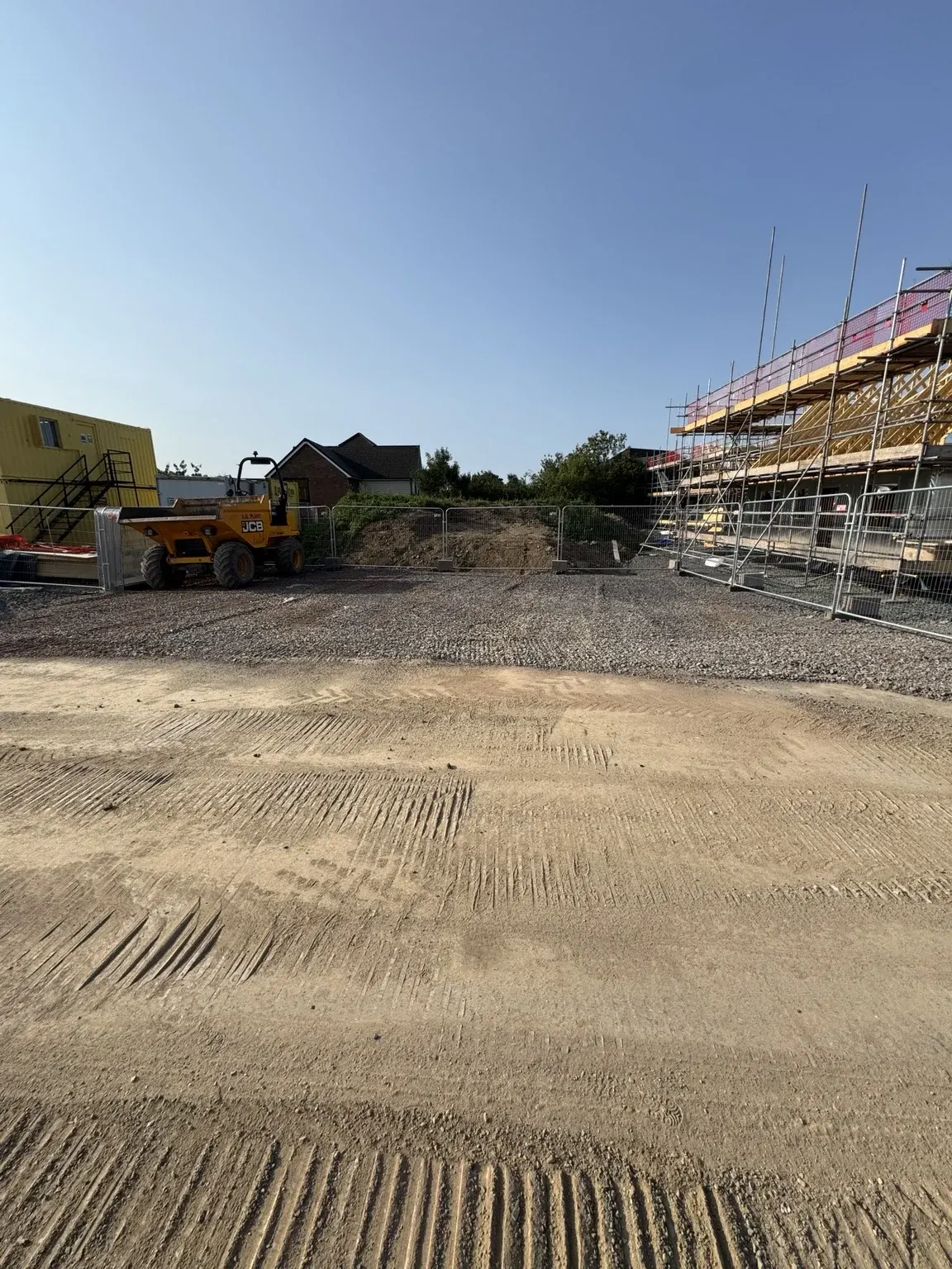 Site preparation beside new homes